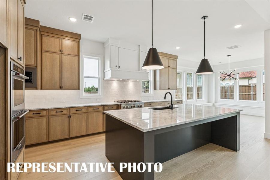 Style and sophistication abound in this dream kitchen!  REPRESENTATIVE PHOTO.