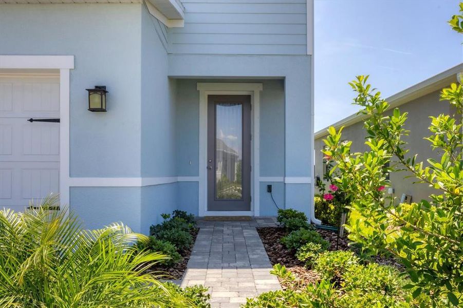 Front exterior of a new home in Avalon Woods, Lakewood Ranch, FL, highlighting curb appeal (Image 25). Front exterior of a new home in Avalon Woods, Lakewood Ranch, FL, highlighting curb appeal (Image 25).