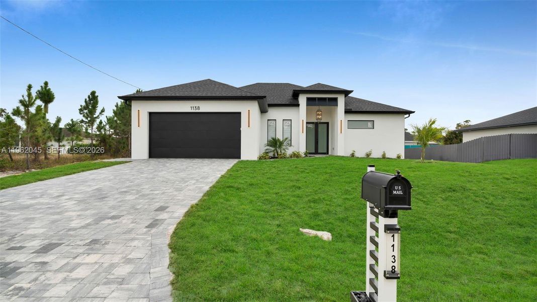 Front exterior of a new home in , Lehigh Acres, FL, highlighting curb appeal (Image 27).