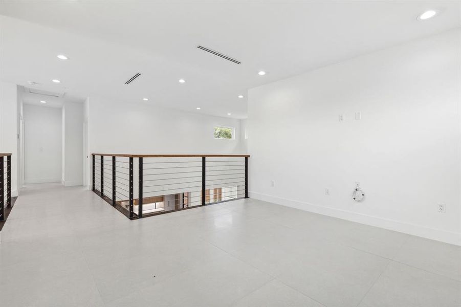 Empty room with light tile patterned floors