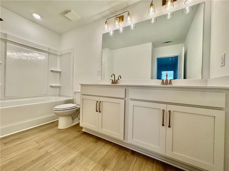 Furnished interior view inside a new home in Eastlyn Crossing, Flowery Branch (Image 10).