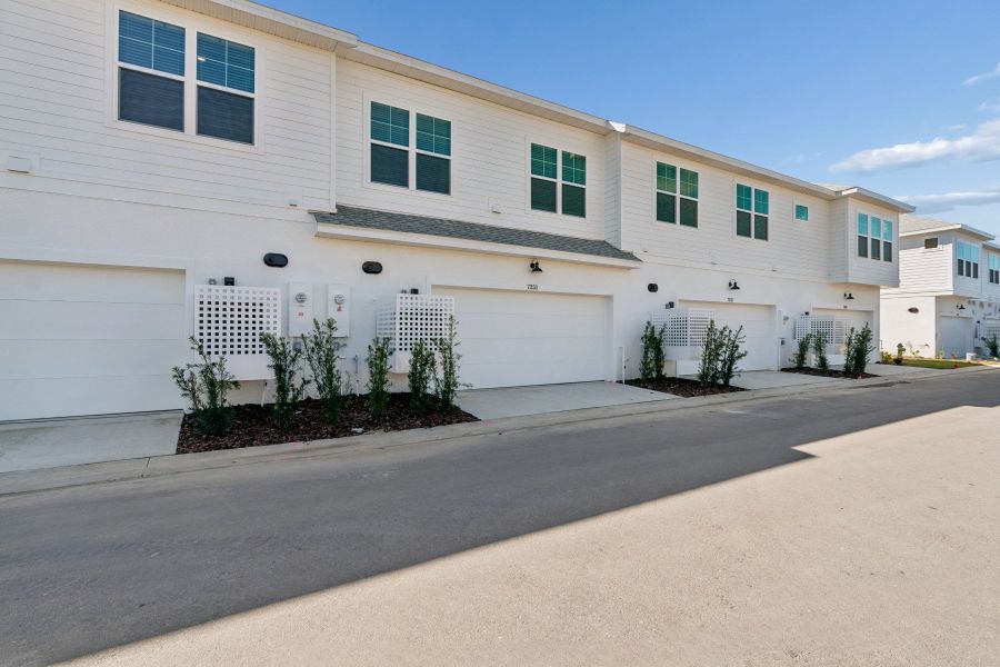 Exterior details and patio area of a home in Emerald Landing at Waterside at Lakewood Ranch – Towns, Sarasota (Image 4).