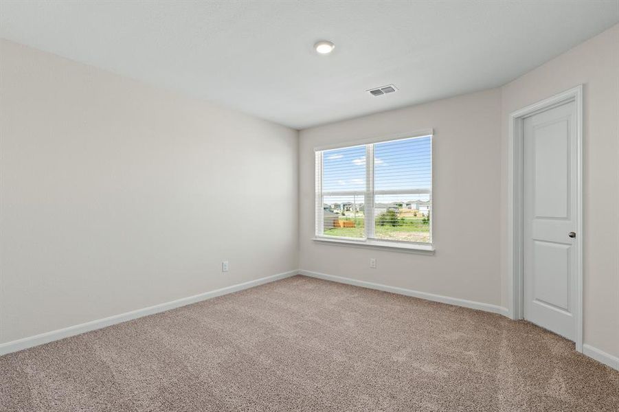 Empty room with baseboards and light carpet