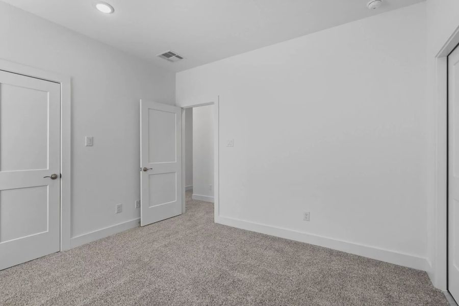 Representative unfurnished interior of a home built from the Waterford by Chesmar Homes in Meridiana 60's, Manvel (Image 41).