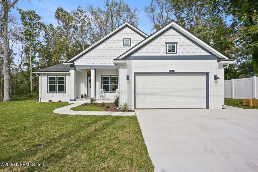 Front exterior of a new home in , Jacksonville, FL, highlighting curb appeal (Image 1).