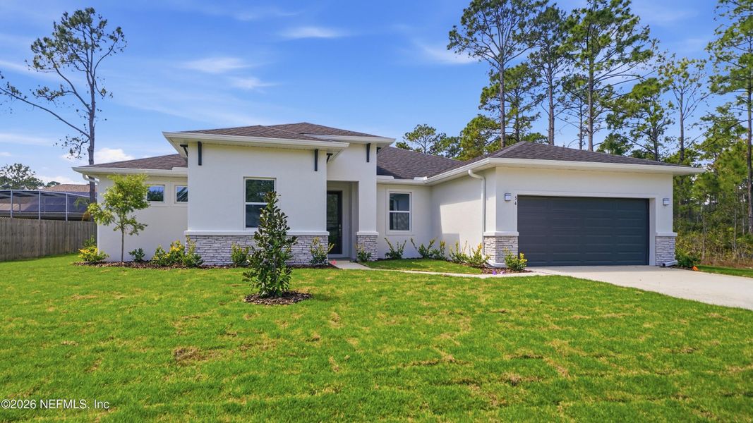 Front exterior of a new home in , Palm Coast, FL, highlighting curb appeal (Image 26).