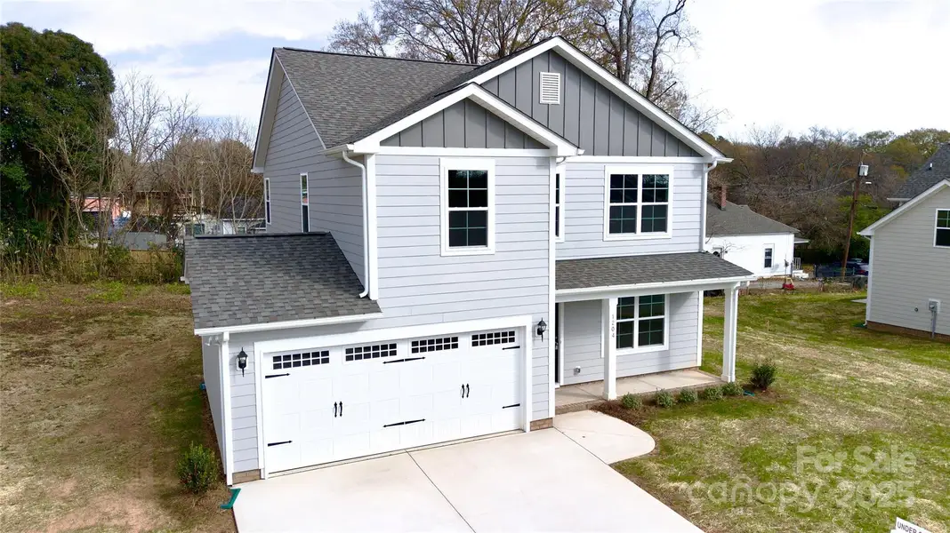 Front exterior of a new home in , Monroe, NC, highlighting curb appeal (Image 1).