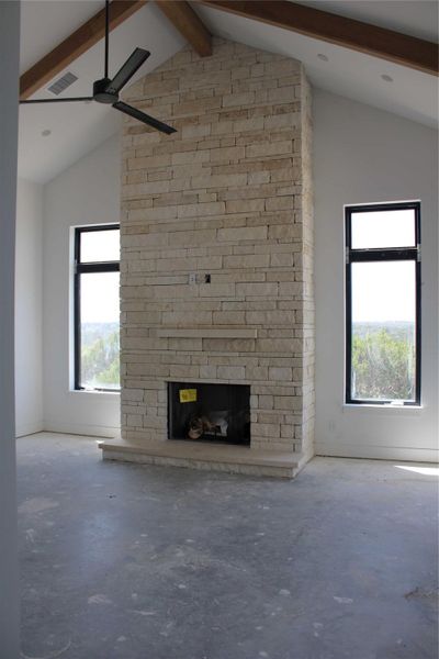 16 ft vaulted beamed ceilings. Limestone dry stacked fireplace. 16 ft vaulted beamed ceilings. Limestone dry stacked fireplace.