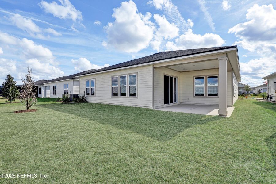 Exterior details and patio area of a home in Discover 55+ Living at Silverleaf, St. Augustine (Image 3).