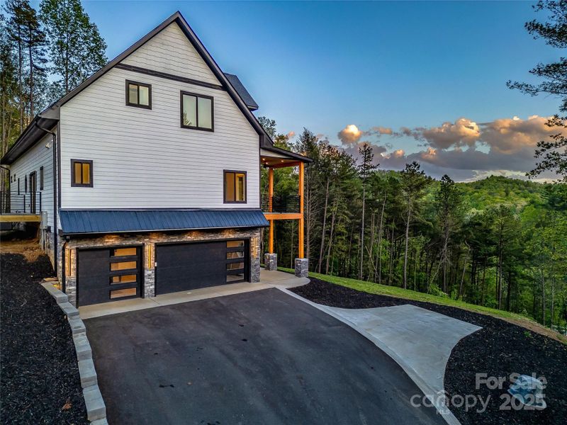 Front exterior of a new home in , Mills River, NC, highlighting curb appeal (Image 1).