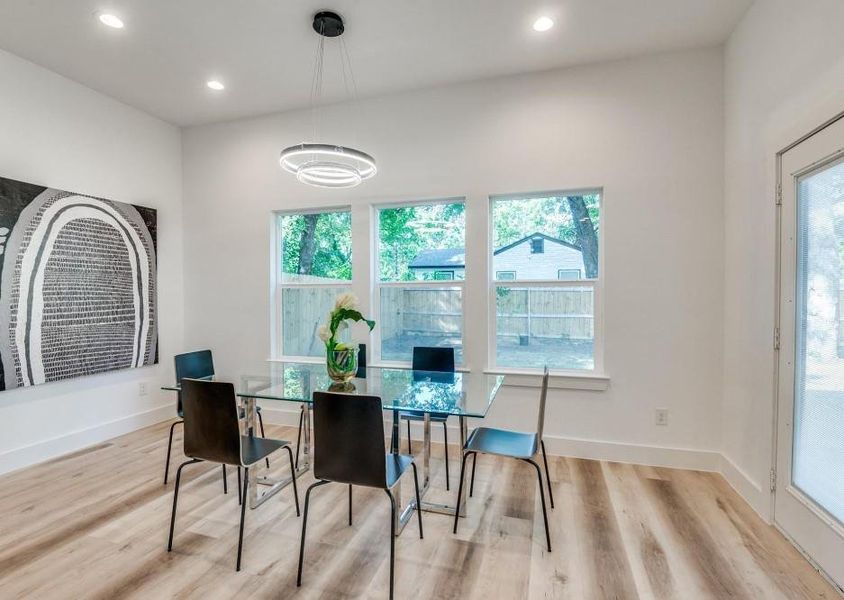 Dining area featuring light wood-type flooring and plenty of natural light