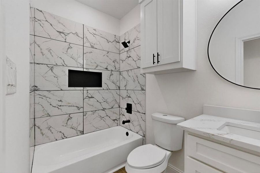 Full bathroom with washtub / shower combination and vanity Full bathroom with washtub / shower combination and vanity