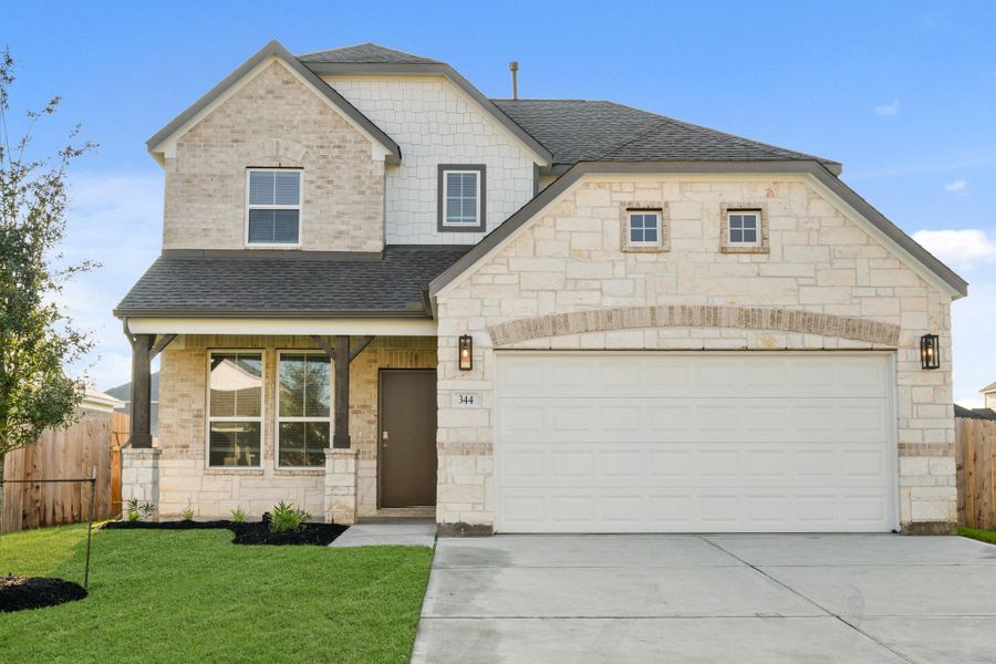 Front exterior of a new home in Beacon Hill, Waller, TX, highlighting curb appeal (Image 2). Front exterior of a new home in Beacon Hill, Waller, TX, highlighting curb appeal (Image 2).