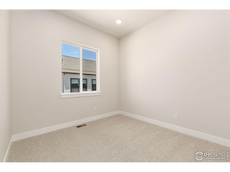 Spacious, unfurnished interior of a new home in Festival at RainDance, Windsor (Image 14).