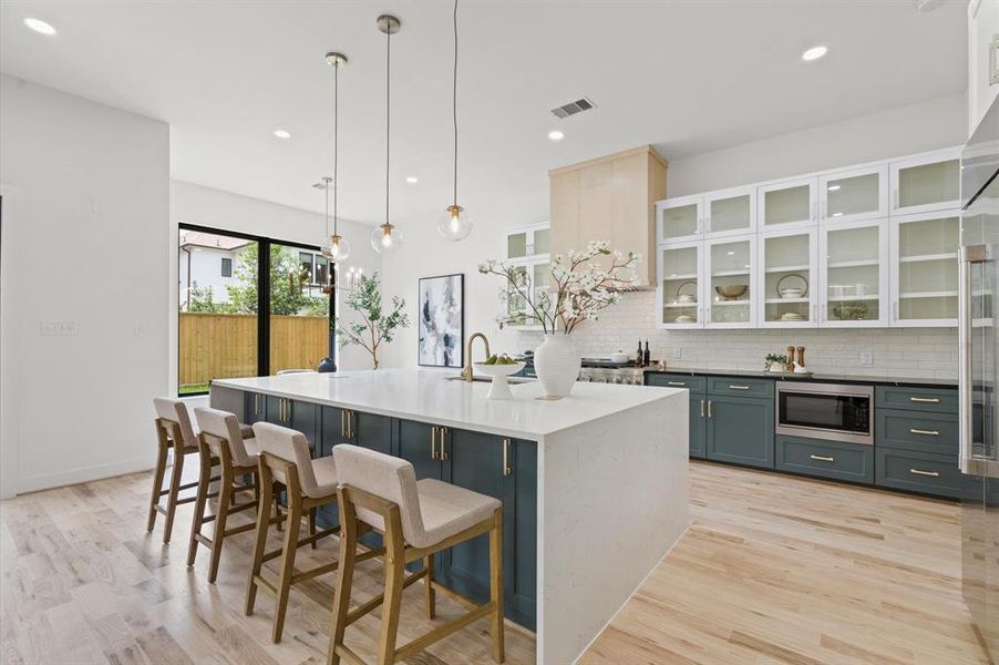 Closer view of the kitchen with an abundance of storage space.