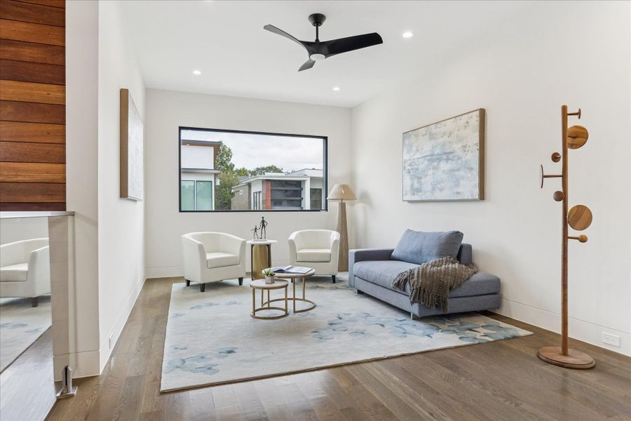 Bright and inviting second-floor family room with modern finishes and plenty of natural light.