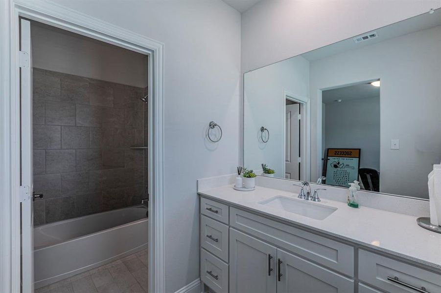 Bathroom with vanity and shower / washtub combination Bathroom with vanity and shower / washtub combination