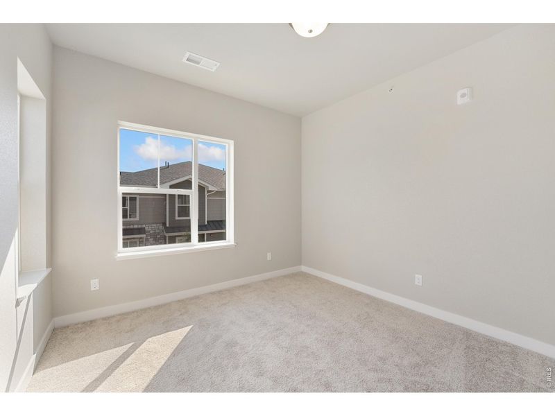 Spacious, unfurnished interior of a new home in The Lakes at Centerra - Discovery, Loveland (Image 15).