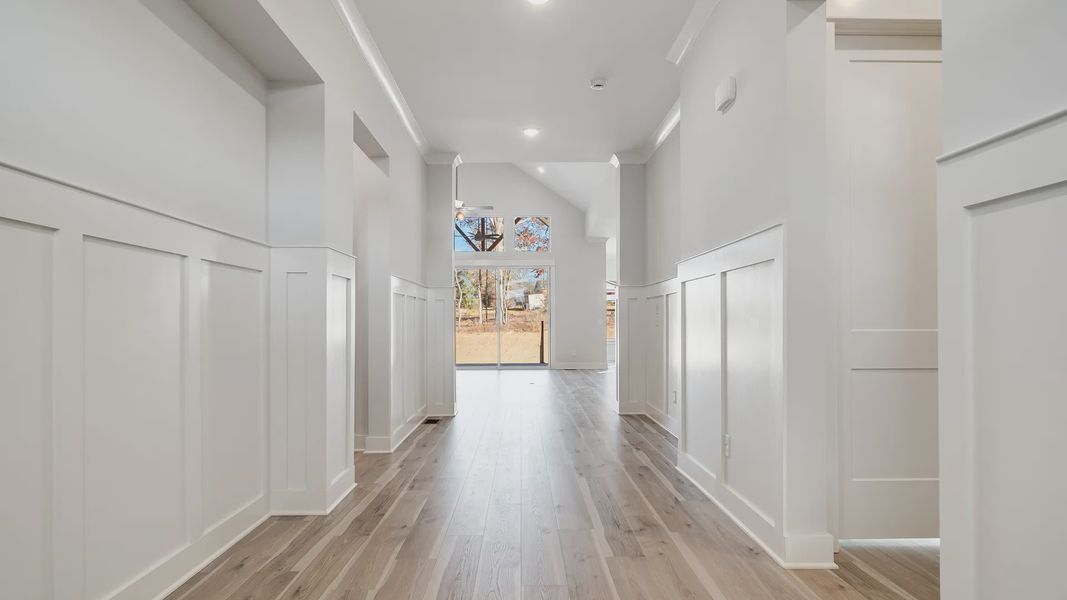 Gorgeous white painted and trimmed hallway with natural light