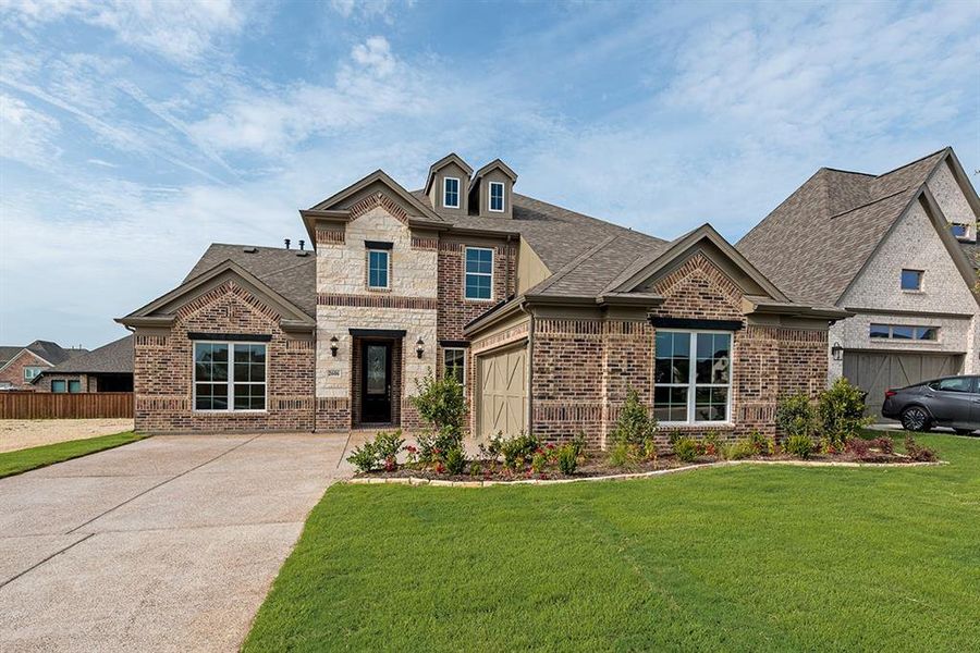 Front exterior of a new home in Somercrest, Midlothian, TX, highlighting curb appeal (Image 2). Front exterior of a new home in Somercrest, Midlothian, TX, highlighting curb appeal (Image 2).