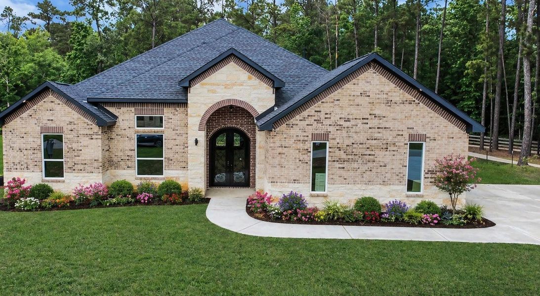 Front exterior of a new home in , Dayton, TX, highlighting curb appeal (Image 17).