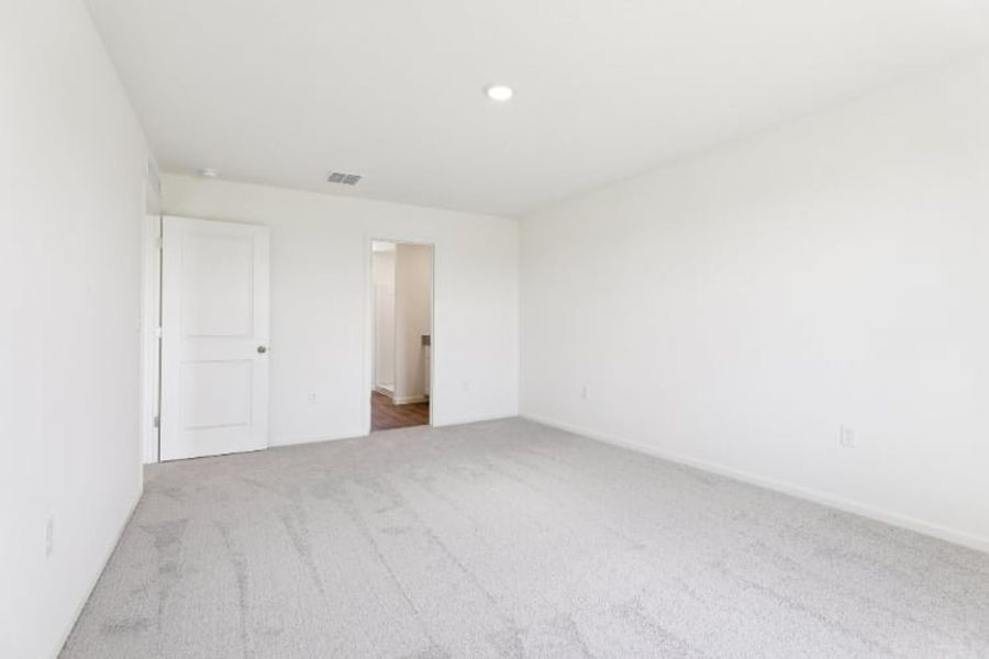 A hallway with white walls.