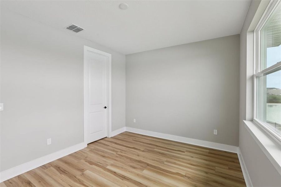 Spacious, unfurnished interior of a new home in Lagoon Residences at Epperson, Wesley Chapel (Image 48).