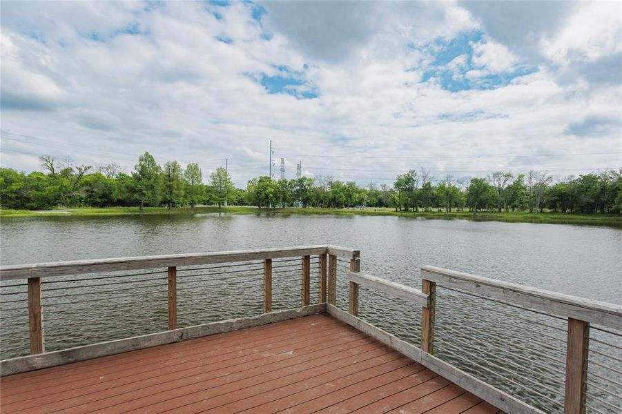 Also at Ablon Park there is Wood-finish deck with a cable railing system overlooking a body of water