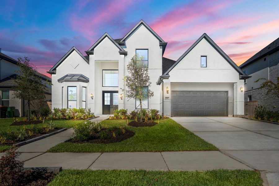 Front exterior of a new home in Sienna 70' Lots, Missouri City, TX, highlighting curb appeal (Image 25). Front exterior of a new home in Sienna 70' Lots, Missouri City, TX, highlighting curb appeal (Image 25).