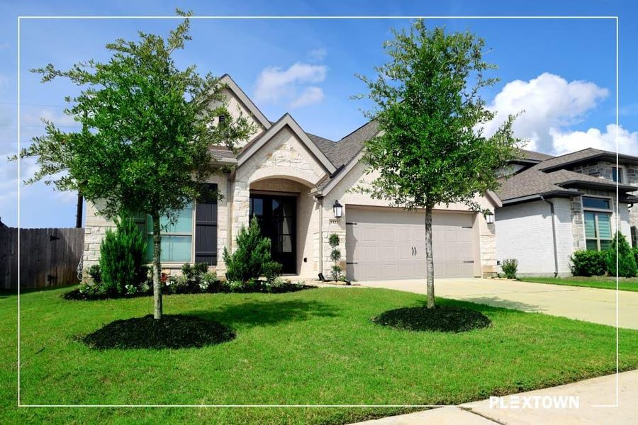 Front exterior of a new home in StoneCreek Estates, Richmond, TX, highlighting curb appeal (Image 2). Front exterior of a new home in StoneCreek Estates, Richmond, TX, highlighting curb appeal (Image 2).