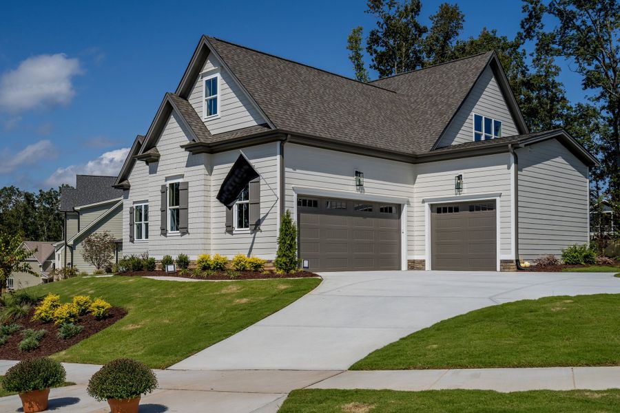 Representative exterior photo of a completed home built from the Covington by Homes by Dickerson in Cattail, Clayton, NC (Image 11). Representative exterior photo of a completed home built from the Covington by Homes by Dickerson in Cattail, Clayton, NC (Image 11).