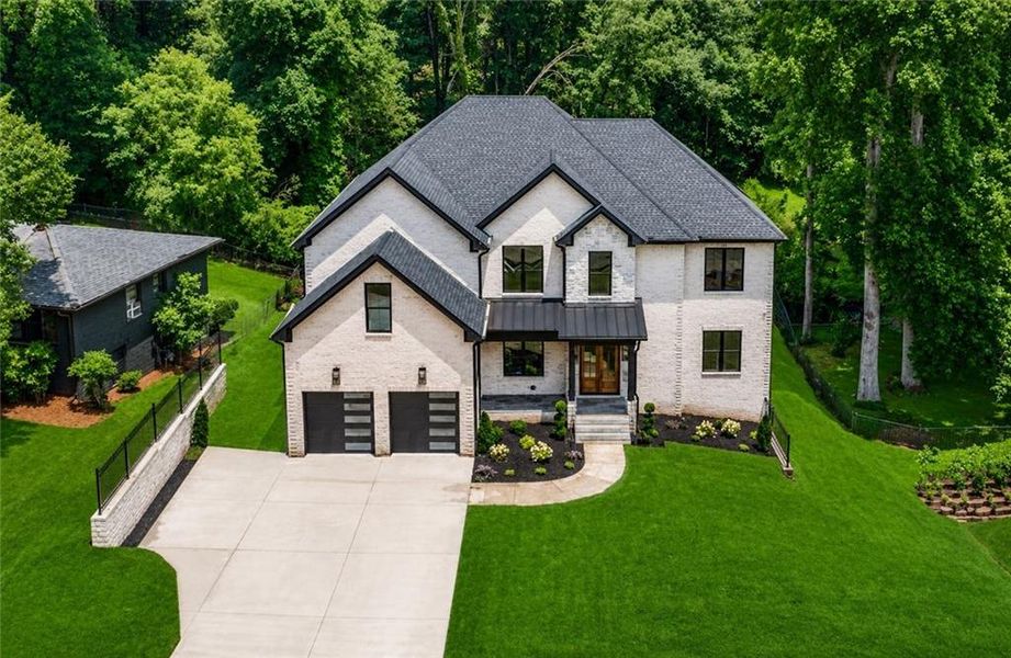 Front exterior of a new home in , Buford, GA, highlighting curb appeal (Image 28). Front exterior of a new home in , Buford, GA, highlighting curb appeal (Image 28).