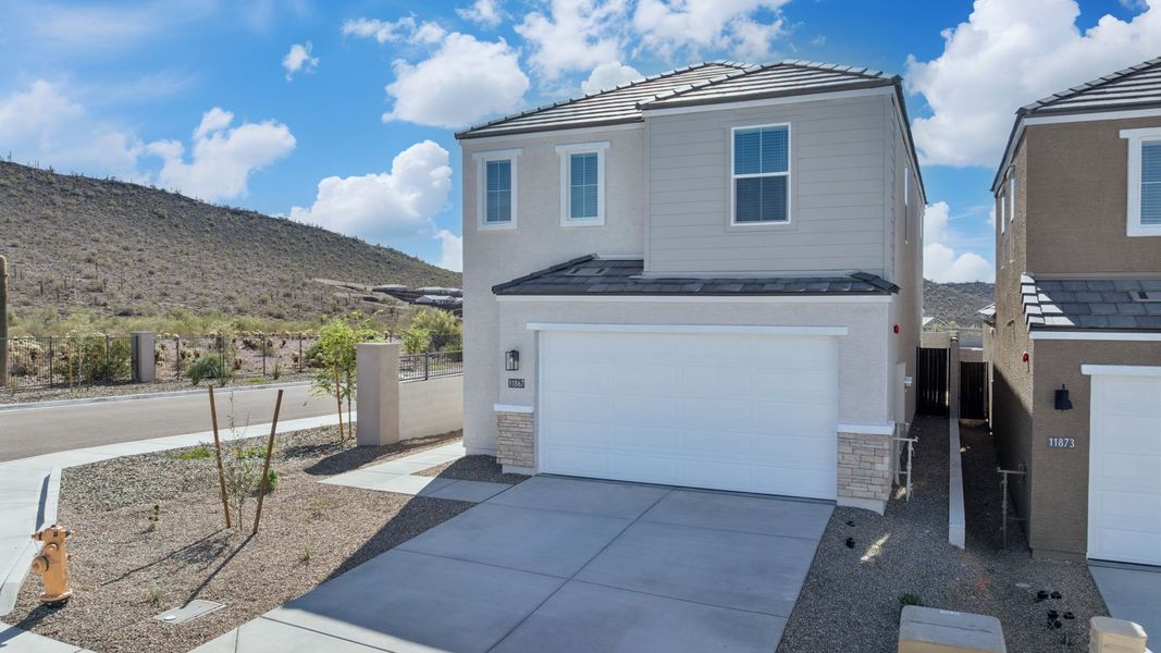 Front exterior of a new home in The Buttes at Mystic, Peoria, AZ, highlighting curb appeal (Image 27).