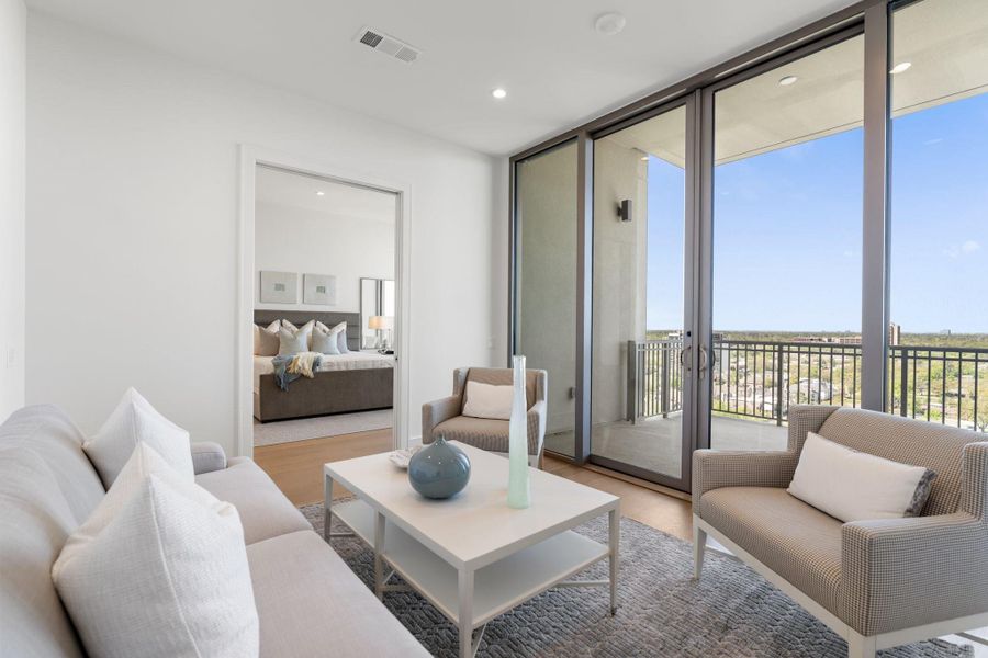 Pocket doors separate the primary suite cozy living & seating area from the bedroom with a private terrace Pocket doors separate the primary suite cozy living & seating area from the bedroom with a private terrace