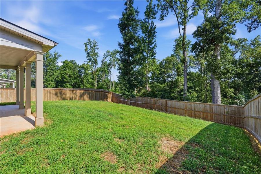 Exterior details and patio area of a home in The Enclave at Flat Rock Hills, Stonecrest (Image 21).