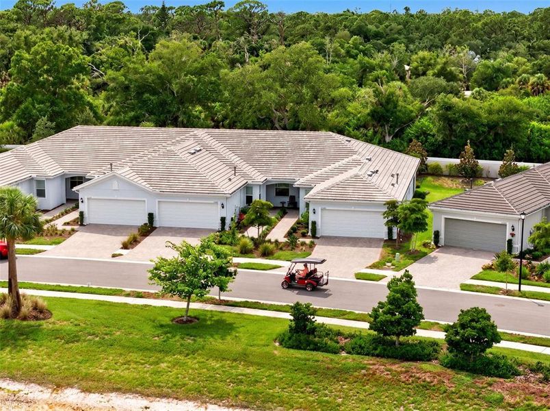 Front exterior of a new home in , Englewood, FL, highlighting curb appeal (Image 27).