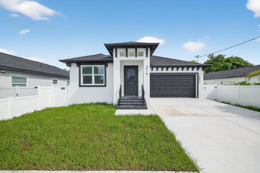Front exterior of a new home in , Tampa, FL, highlighting curb appeal (Image 25).