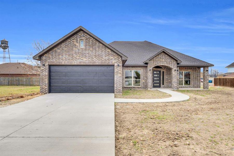 Front exterior of a new home in , Palmer, TX, highlighting curb appeal (Image 15). Front exterior of a new home in , Palmer, TX, highlighting curb appeal (Image 15).