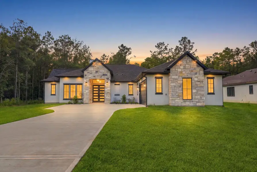 Front exterior of a new home in , Dayton, TX, highlighting curb appeal (Image 1). Front exterior of a new home in , Dayton, TX, highlighting curb appeal (Image 1).