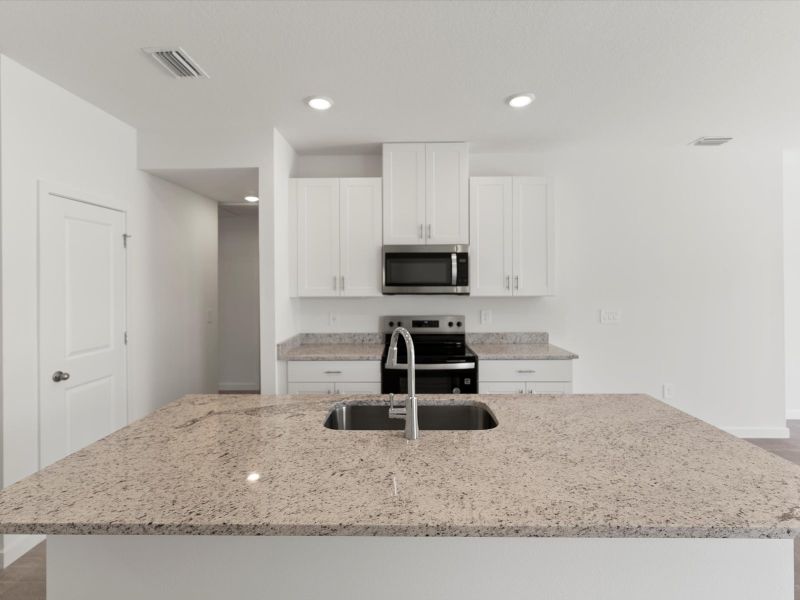 Furnished interior view inside a new home in Flagler Village - Classic Series, Palm Coast (Image 6).