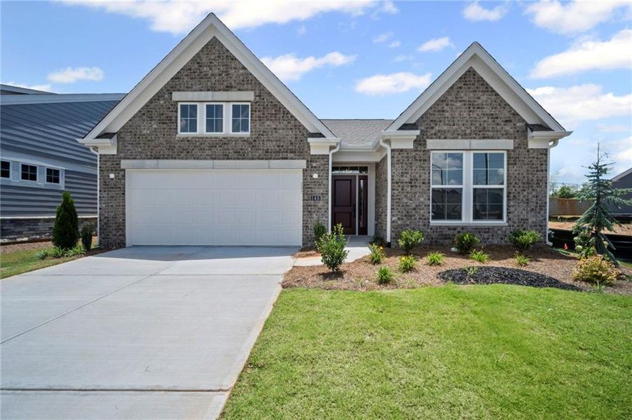 Front exterior of a new home in Laurel Farms, Dallas, GA, highlighting curb appeal (Image 26).