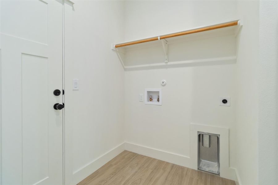 Laundry room on main level with access to the attached garage Laundry room on main level with access to the attached garage