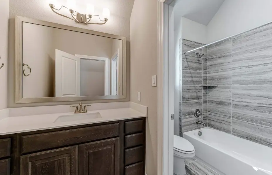 Representative furnished interior of a home built from the 3798 by Ravenna Homes in The Woodlands Hills 65′, Willis (Image 28).