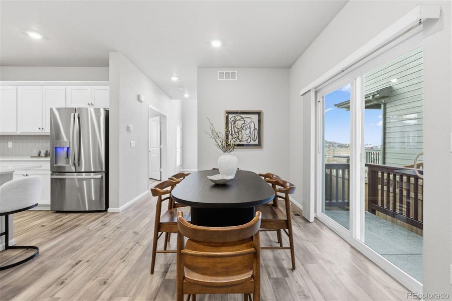 Furnished interior view inside a new home in Woodrose at Painted Prairie, Aurora (Image 9).