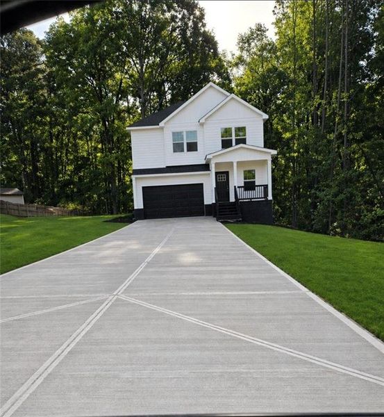 Front exterior of a new home in , Stockbridge, GA, highlighting curb appeal (Image 1). Front exterior of a new home in , Stockbridge, GA, highlighting curb appeal (Image 1).