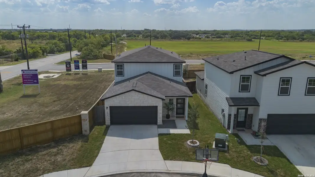 Front exterior of a new home in Applewhite Meadows, San Antonio, TX, highlighting curb appeal (Image 22).