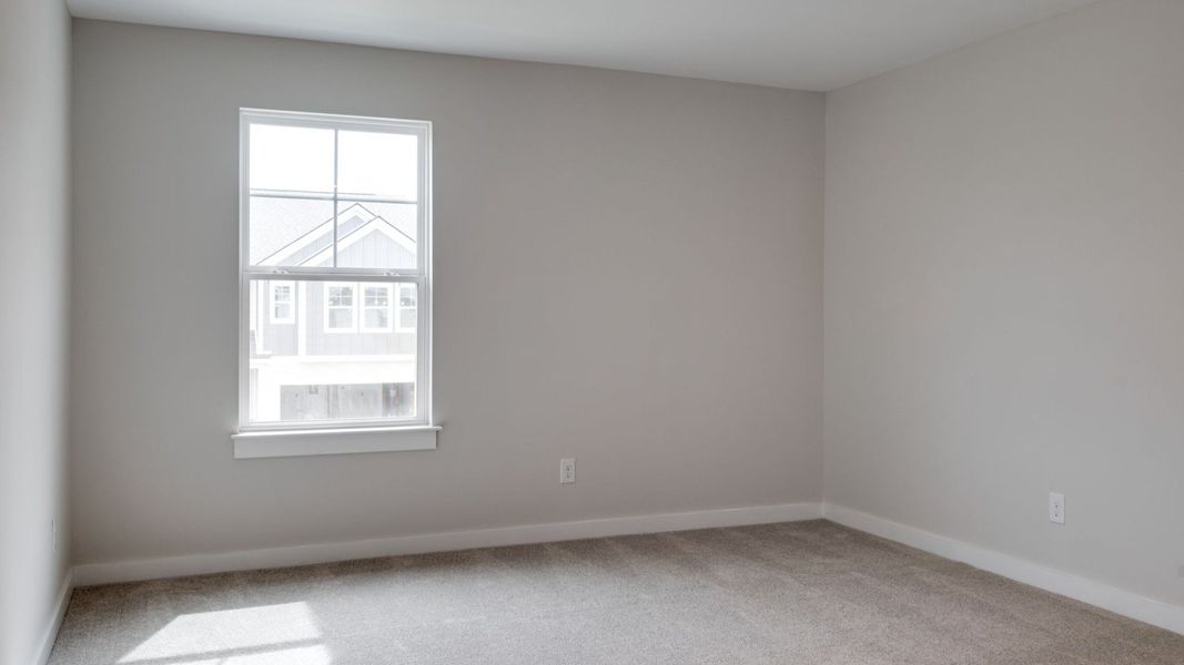 Primary room with connected bathroom and walk-in closet