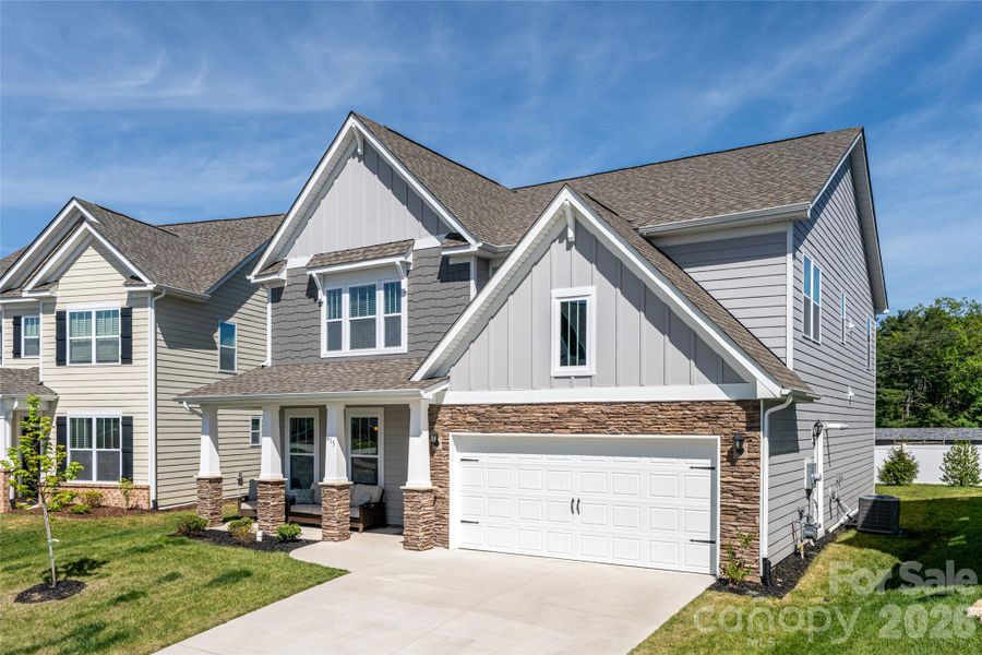 Front exterior of a new home in Cantrell Hills, Hendersonville, NC, highlighting curb appeal (Image 1). Front exterior of a new home in Cantrell Hills, Hendersonville, NC, highlighting curb appeal (Image 1).