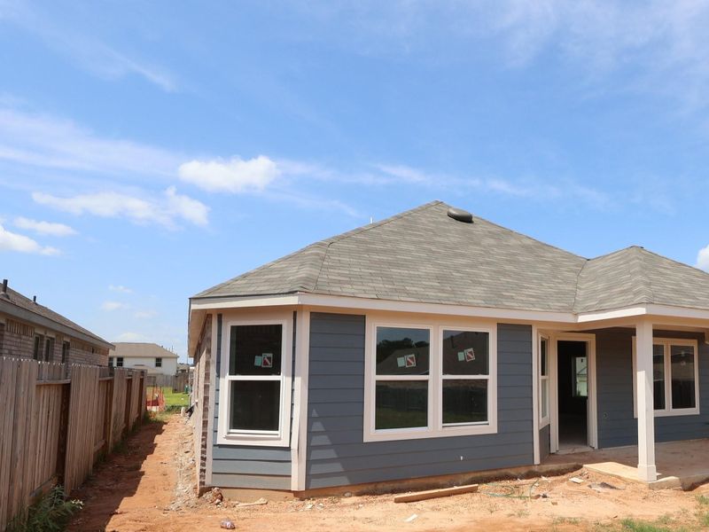 Front exterior of a new home in Magnolia Ridge, Magnolia, TX, highlighting curb appeal (Image 13). Front exterior of a new home in Magnolia Ridge, Magnolia, TX, highlighting curb appeal (Image 13).