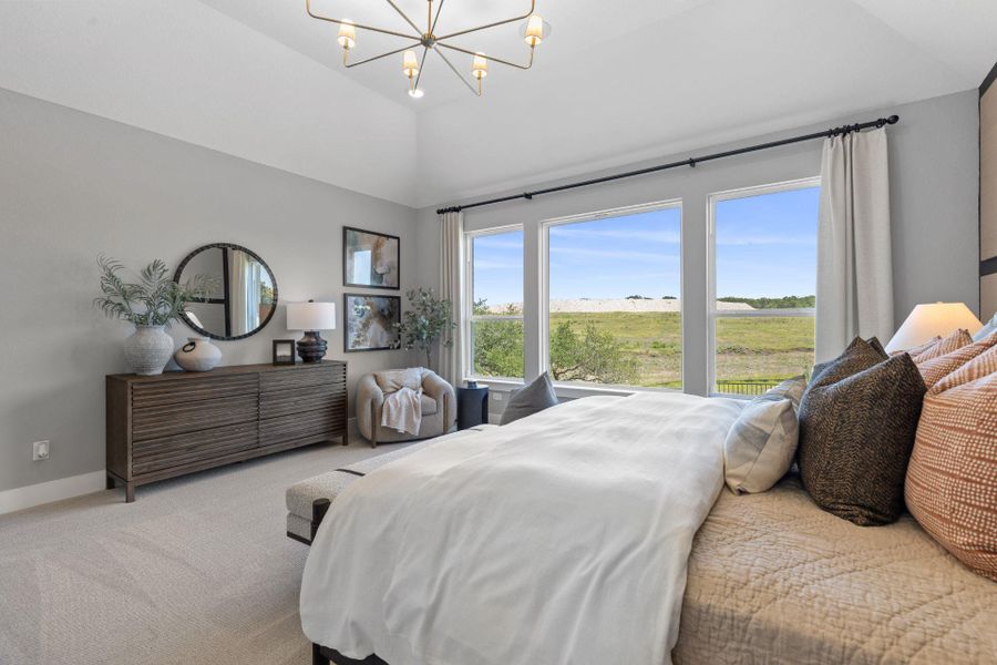 Primary Bedroom with elevated ceiling Primary Bedroom with elevated ceiling